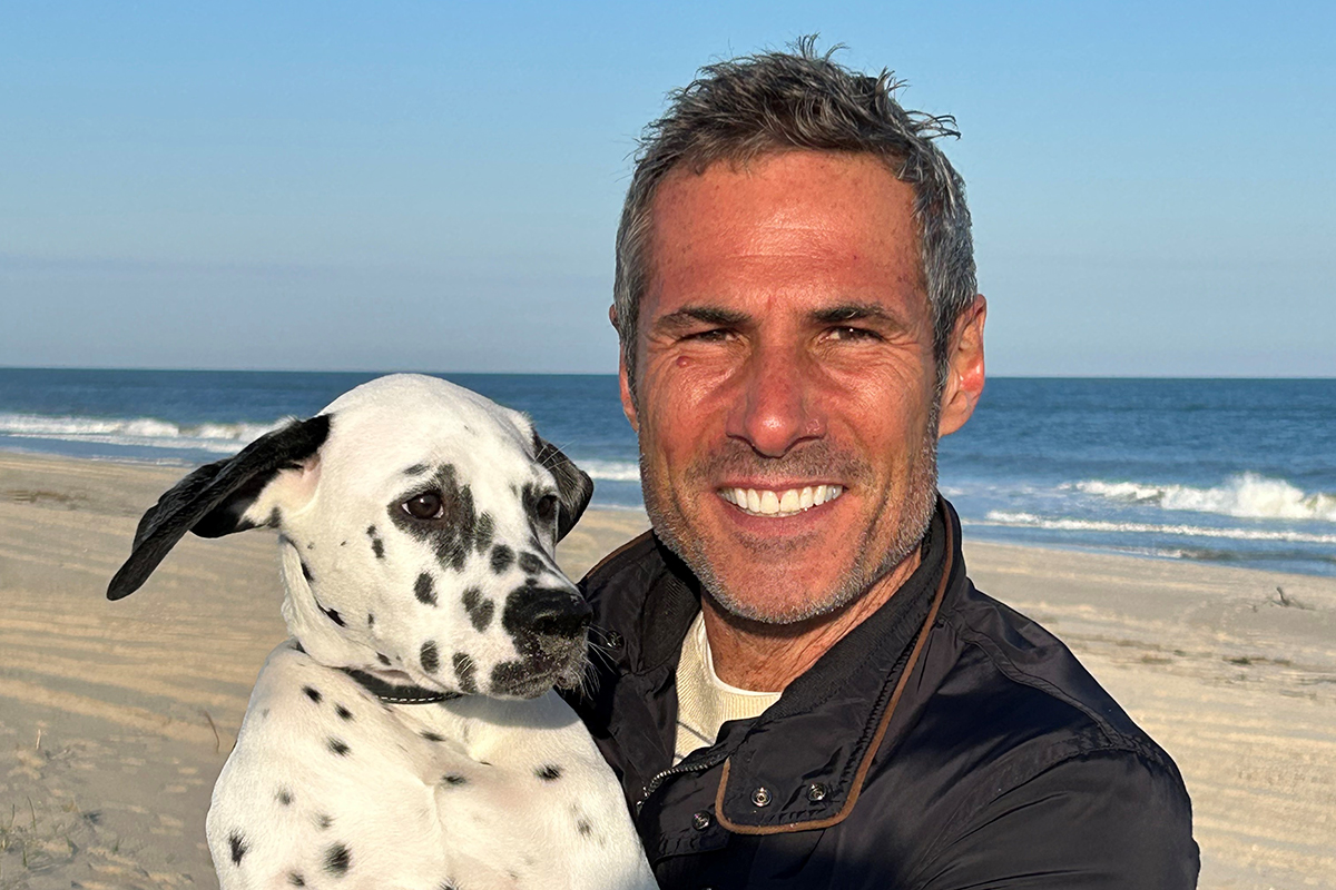 Marc Scarduffa is seen on the beach with his dog. 