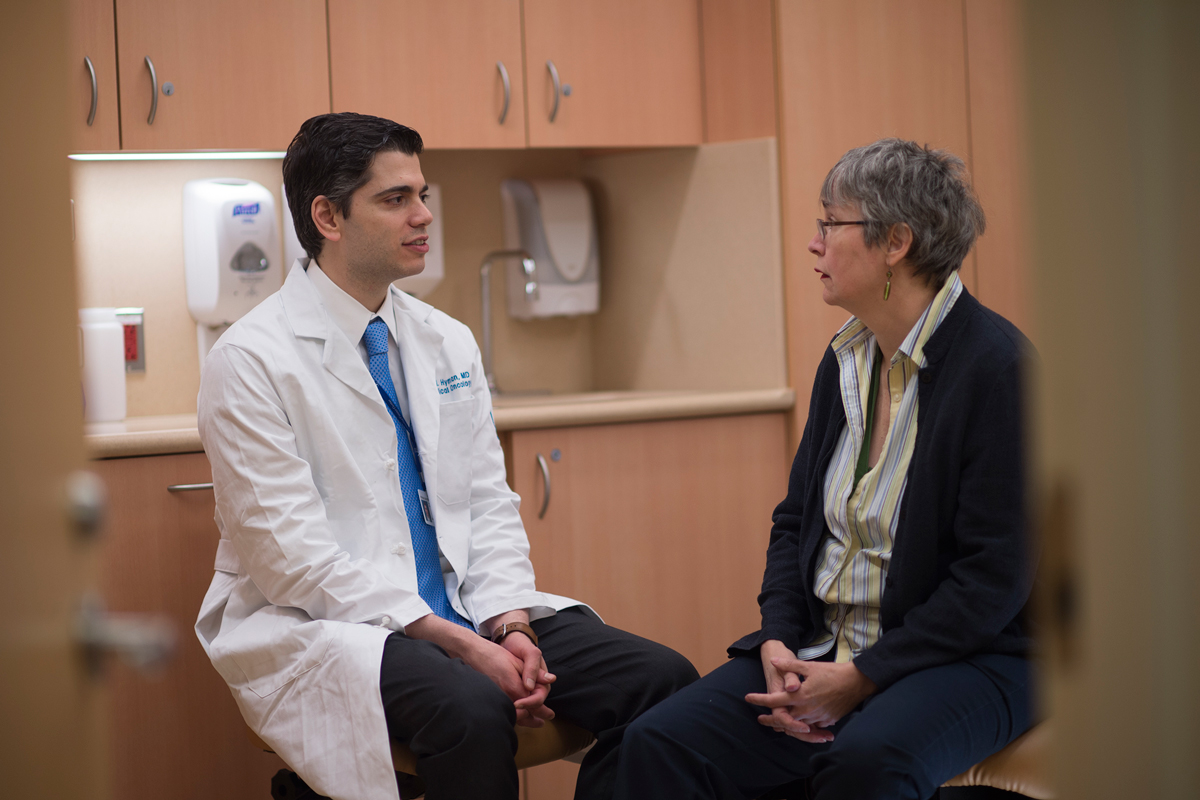 David Hyman, MD, speaks to a patient
