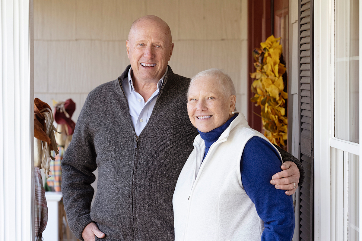 Mary and Jim Oehrlein, pictured here hugging, are grateful she is surviving pancreatic cancer.