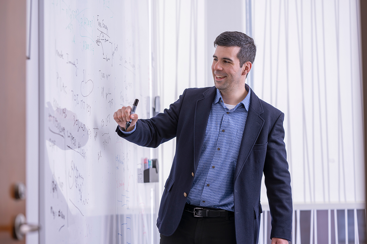 instructor writing on whiteboard