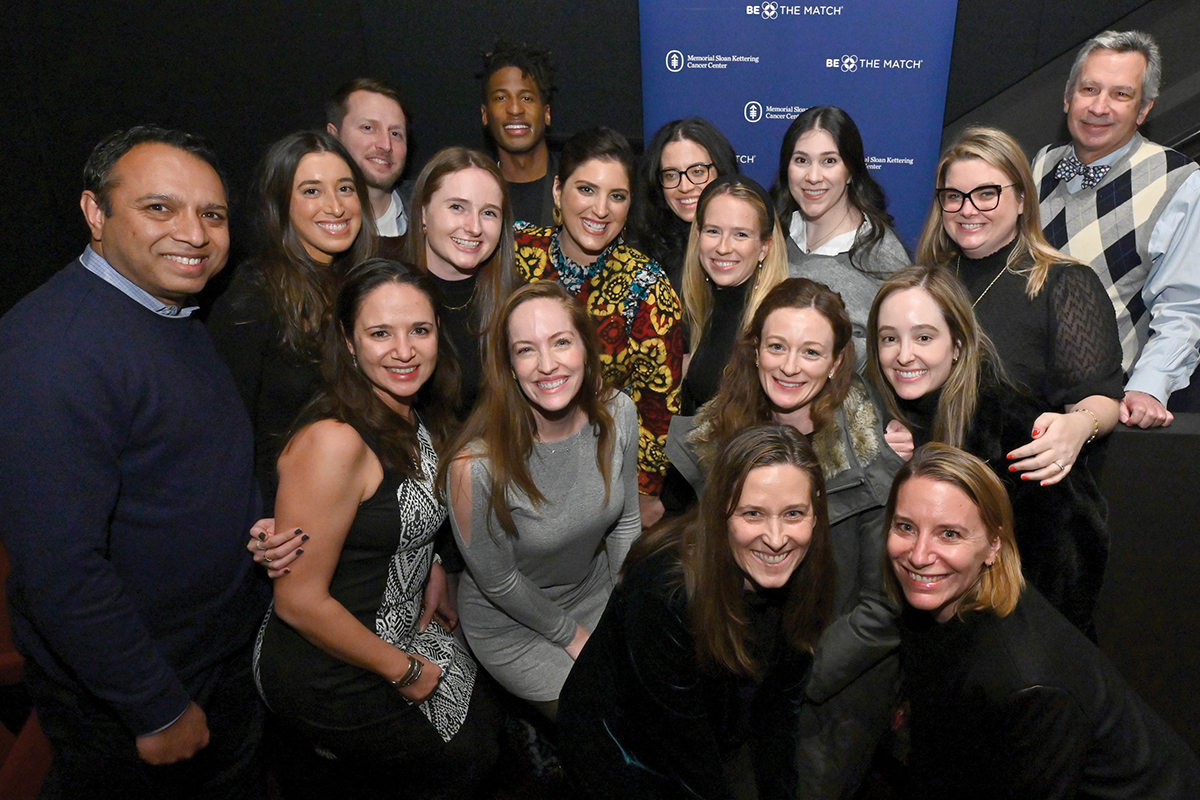 Suleika seen smiling with MSK team members at film screening. 