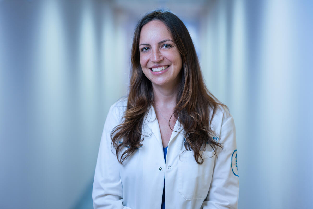 Dr. Robin Mendelsohn is seen smiling in a hallway. 