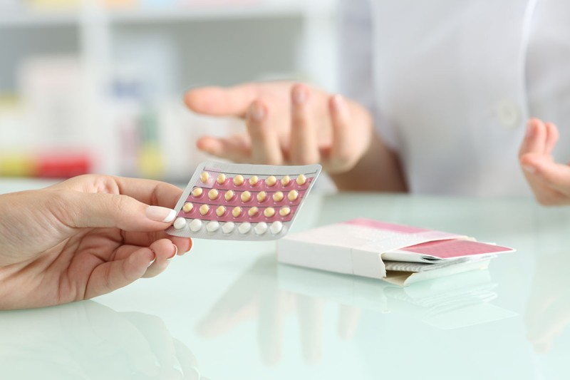 A woman considering birth control pills