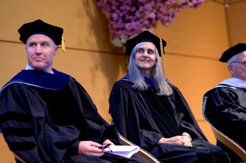 Michael Overholtzer and Ushma Neill sit on the stage 