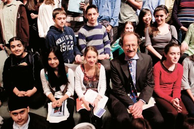 Students pose with Memorial Sloan Kettering President Harold Varmus after the symposium.