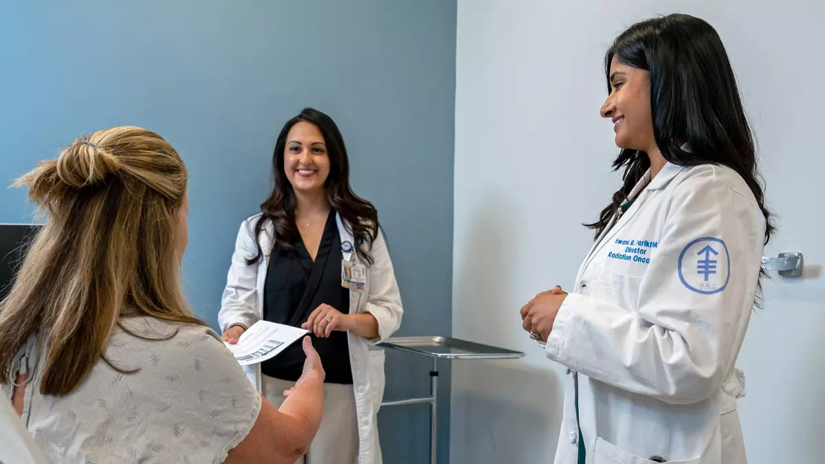 Dr. Dhwani R. Parikh, Director of Radiation Oncology, with others.