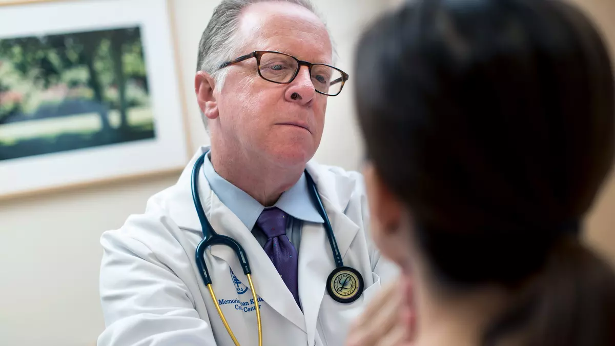 Andrew D. Seidman, MD, an MSK breast medical oncologist, talks with a patient.