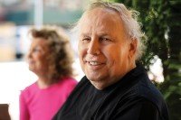 A man in his 70s (prostate cancer patient) smiling for camera