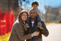 Reilly Starr with her husband and their son on her husband's shoulders