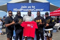 Group of Black men posing at prostate cancer fundraising walk. 