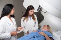 Two doctors looking at a patient