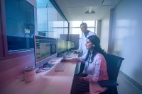 Ankita Dhar and Jason De La Cruz at work in MSK's cryo-EM facility