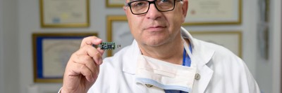 Dr. Gaetano Rocco is seen holding a component of the E-nose lung cancer test. 