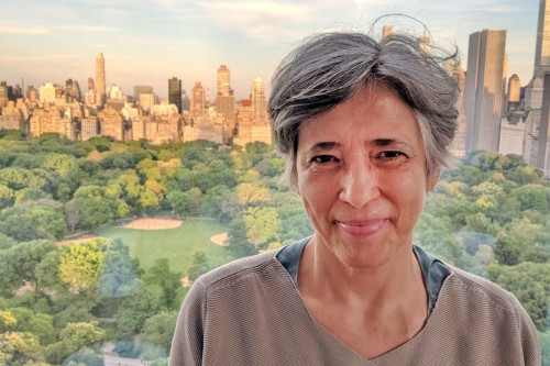 Woman smiling with Central Park in the background.