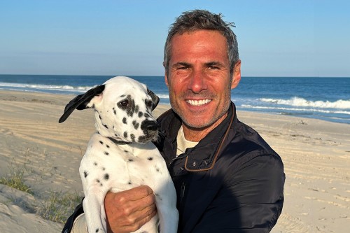 Marc Scarduffa, pictured with his dog Ulysse, was able to keep working during the clinical trial he took part in at MSK.