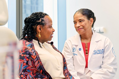 MSK patient Linda Collins is seen in an exam room with Dr. Carol Brown. 