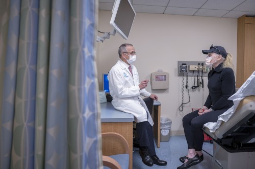 Colorectal cancer surgeon Dr. Julio Garcia-Aguilar talking with a patient.